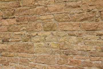 Antique light brown limestone wall texture with thick mortar and grunge look