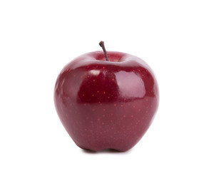 Fototapeta na wymiar Red apple isolate closeup. Dark red juicy apple on a white background.