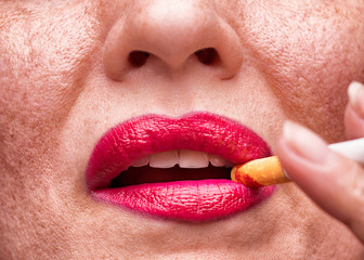 Naklejka premium Smoking woman close-up. Concept of skin problems related to tobacco smoking. A woman smokes a cigarette. 