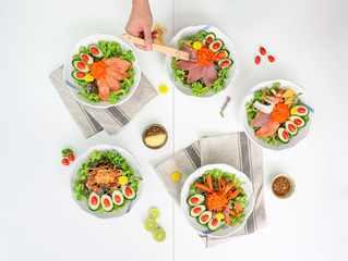 Variety of Salad with Salmon, Maguro, Spider crab,Kani and Seafood set on the table