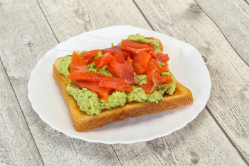 Toast with guacamole and salmon