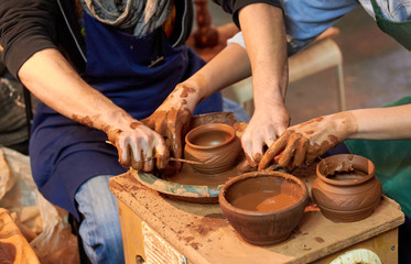 Hands of potters, was produced on range of pot.