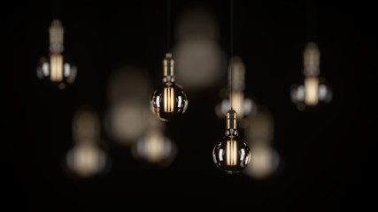 Decorative vintage light bulbs in Edison style on a black background. 3D rendering.