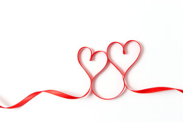 hearts from ribbons on a white background top view.