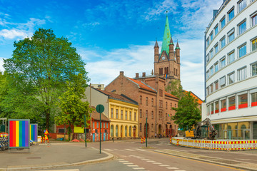 View of a street in Oslo and Greenland Church (Grønland Kirke) on Pride parade days, Norway