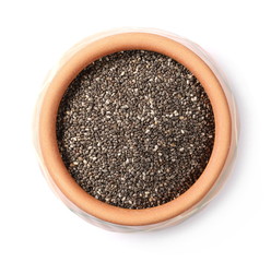 Chia seeds in clay pot isolated on white background, top view