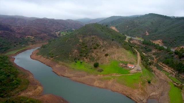 Aerial. Flying drone in fog and clouds over the hills in Monchique Portugal.
