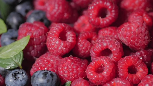 Close Up Rotation Loopable Raspberry. Fresh, Juicy Raspberry Background, Ripe. Macro Red Raspberries Fruit. Fresh Raspberry Fruits As Food Dackground. Healthy Food Organic Nutrition.