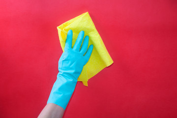 doing cleaning with green rubber gloves
