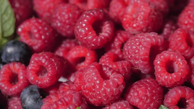 Close Up Rotation Loopable Raspberry. Fresh, Juicy Raspberry Background, Ripe. Macro Red Raspberries Fruit. Fresh Raspberry Fruits As Food Dackground. Healthy Food Organic Nutrition.