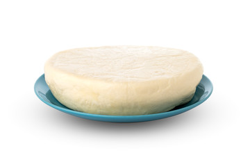 Cheese on a plate on a white background. Cheese closeup on a white background.