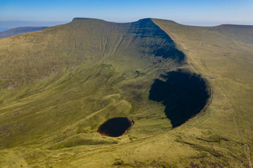 Fototapeta Aerial drone view of the twin peaks of mountains Corn Du and Pen-y-Fan in the Brecon Beacons of Wales, UK obraz