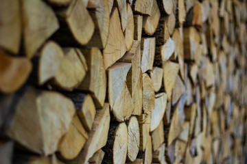 masonry in the wall of sawn wooden chopped logs