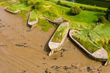Aerial view of abandoned hulls of boats at the Purton Hulks (Ship Graveyard)