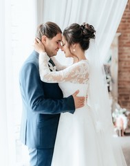 Fototapeta premium Happy bride and groom on their wedding