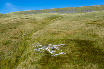 Aerial drone view of an old aircraft (Vampire) wreck on the slopes of Fan Hir in the Brecon Beacons, Wales