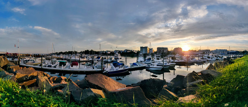 Golden hour sunset over harbor - panorama view of Harbor View, Stamford City, Connecticut