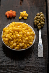 White plate on rustic table with vegetables.