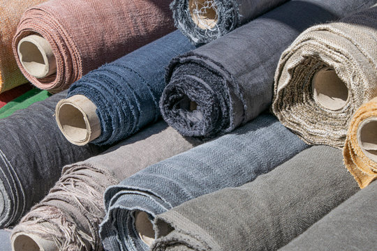 Rolls of linen canvas textile on market stall