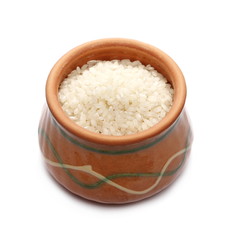 Rice pile in clay pot isolated on white background 