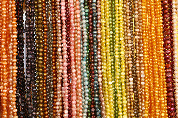 String of colorful bead necklace on retail display