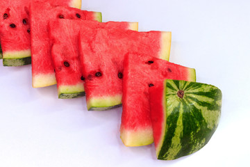Sliced watermelon on a white background, background and texture of ripe juicy watermelon.