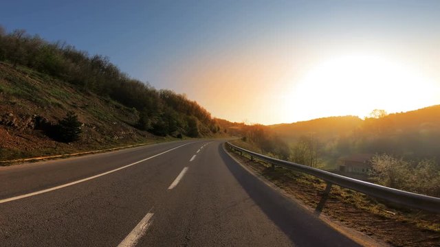 Sunset drive on highway, cinematic pov