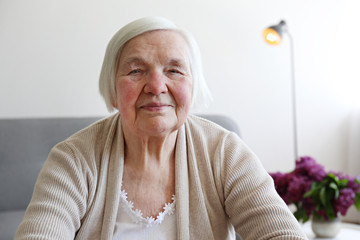Senior woman relaxing to end headache. Shallow DOF.