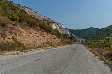 Autumn landscape of  deciduous forest with glade and road in the Sredna Gora, mountain, Bulgaria 