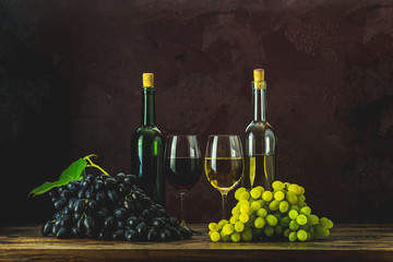 Red and white wine and grapes  bottles and glasses