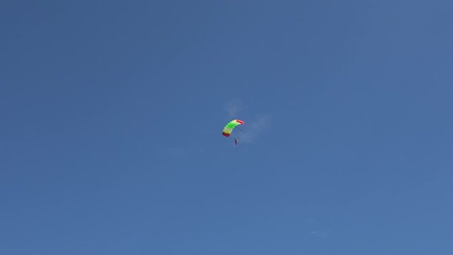 Korotich, Ukraine - 11th of August 2019: 4K Training at the Korotich airdrom - Tandem parashute descending against the blue sky