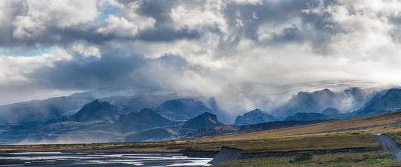Markarfljót Valley and the Rauðafossafjöll massif, east of the volcano Hekla. Note vehicle on road at right of image for scale.