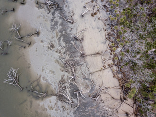 Aerial straight down view of hurricane damage and eroded beach in South Carolina.