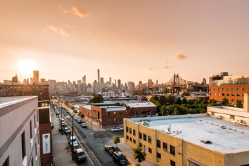 Long island City, New York City/ USA - 08 21 2017: Sunset view to the Queensboro Bridge and Manhattan skyline in LIC NYC Big Apple with skyscrapers and the amazing skyline of the metropolis