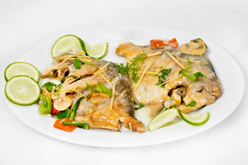 Pomfret fish pieces on plate, spicy Indian dish. Popular amongst Bengalis and south Asia for it's taste.