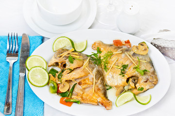 Pomfret fish pieces on plate, spicy Indian dish. Popular amongst Bengalis and south Asia for it's taste.