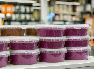 flat jars with pink and cream contents close-up  