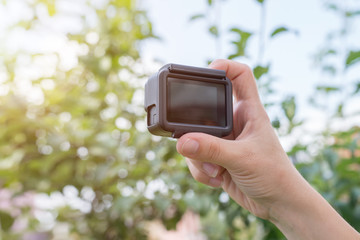 Filmmaking with action camera concept. Blank screen for mockup.