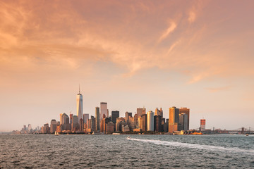 New York City New Jersey, NYC/ USA - 08 21 2017: Amazing sunset on New York City Hudson River on public transport staten island ferry with beautiful panorama view to NYC Manhattan skyline