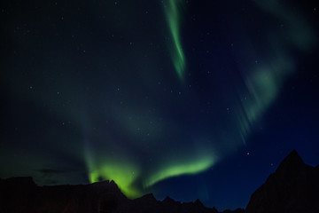 Northern lights above Reine in Lofoten islands in Norway