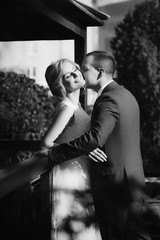 Bride and Groom at wedding Day walking Outdoors on spring nature. Bridal couple, Happy Newlywed woman and man embracing in green park. Loving wedding couple outdoor. 