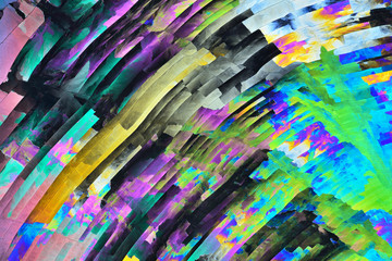 Colorful micro crystals in polarized light. Photo through a microscope.