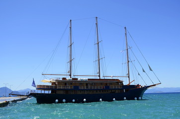Beautiful caravel in the Aegean Sea. Entertainment for tourists and joy for children 
