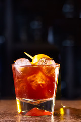 Red cocktail with lemon slice and Apple