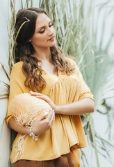 beautiful young  woman in yellow clothes  with melon 