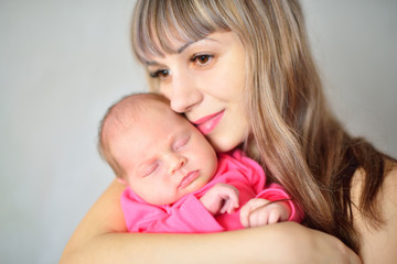 Newborn girl on mother's hands