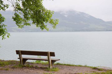 a bench by a lake in Aistrian alps