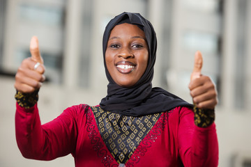 close up of young muslim woman, happy.