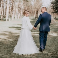 Happy bride and groom on their wedding in garden