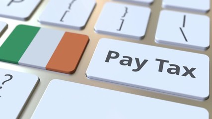 PAY TAX text and flag of the Republic of Ireland on the buttons on the computer keyboard. Taxation related conceptual 3D animation